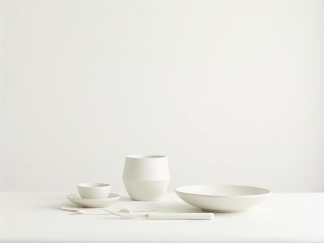 Minimalist ceramic dinnerware on a clean background